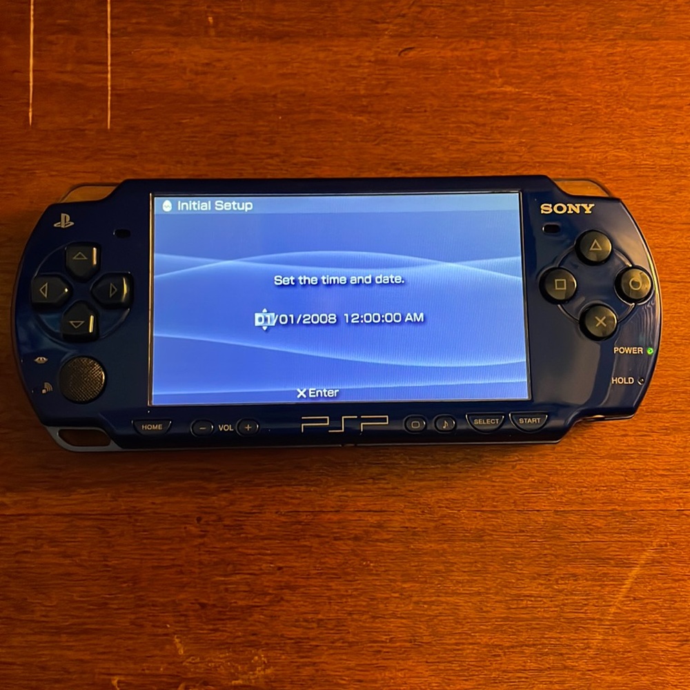 Used Royal Blue PSP-2001 with 4 games and PSP Kit